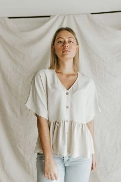 Henly Shae Peplum In Ivory Tops