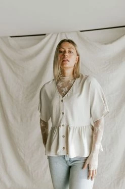 Henly Shae Peplum In Ivory Tops